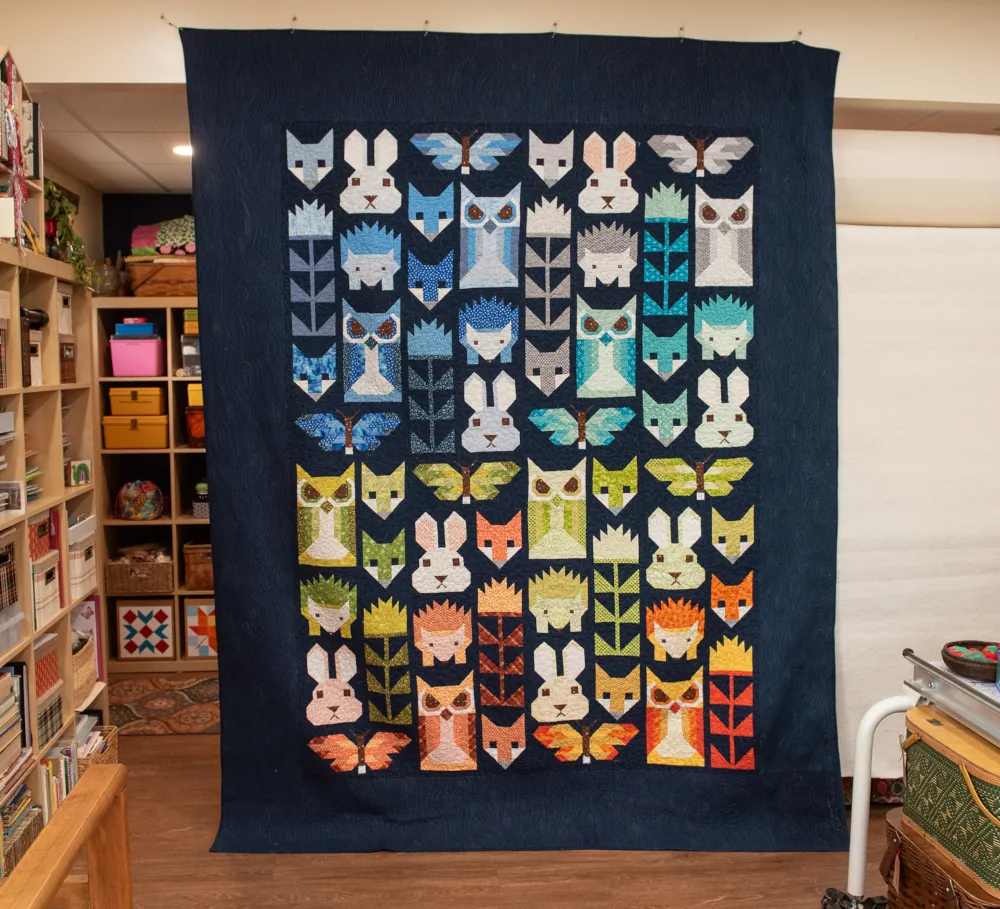 A quilt design with animals all over it