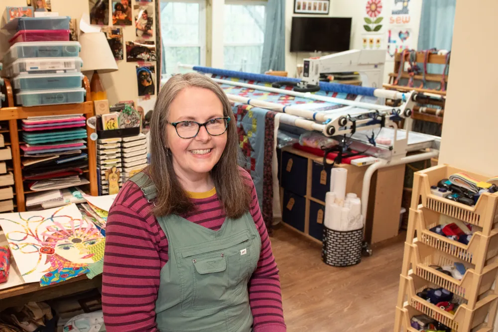 Founder of Blue Goose sitting in their workshop