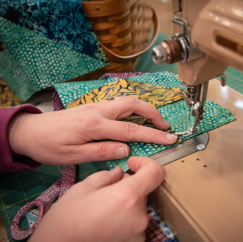 sewing machine being used on a dotted fabric